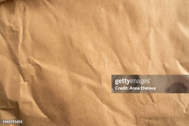 wrapping craft paper with crumpled texture. concept of using recycled materials. background for your design with copy space - carta da pacchi foto e immagini stock