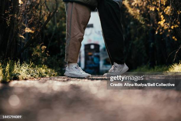 gay male couple kissing - bokeh love stock pictures, royalty-free photos & images