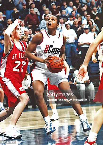 American basketball player Tamika Williams of the University of Connecticut with the ball during a game against St. Francis College at the Gampel...