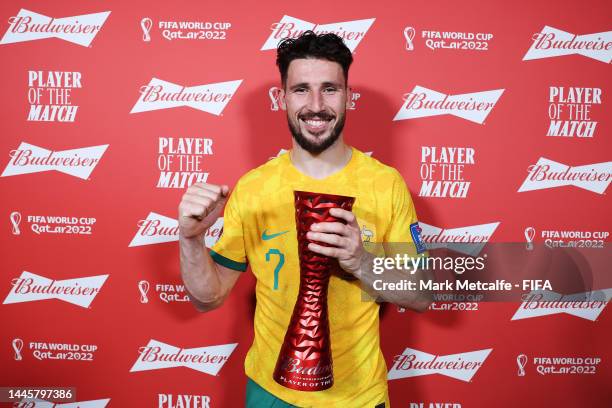 Mathew Leckie of Australia celebrates with the Budweiser Player of the Match Trophy following the FIFA World Cup Qatar 2022 Group D match between...