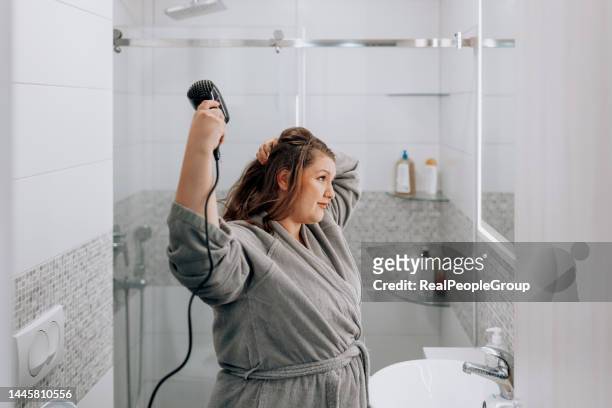 i like my hair straight - blow drying hair stock pictures, royalty-free photos & images