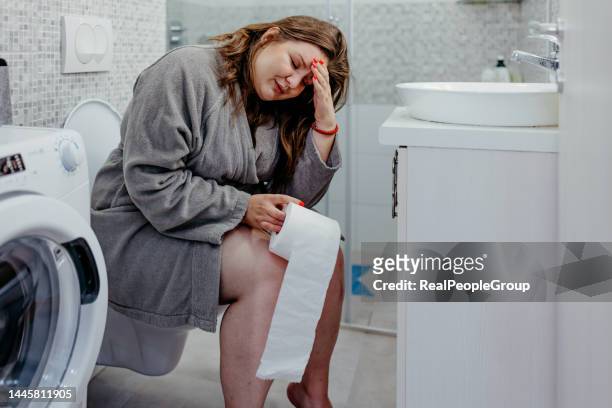 poor plus size woman with stomach problems - woman hemorrhoids stock pictures, royalty-free photos & images