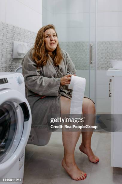 this is awful - woman hemorrhoids stock pictures, royalty-free photos & images