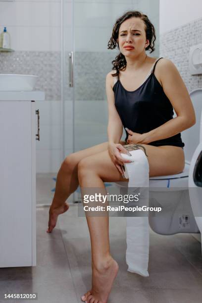 this is a total disaster - woman hemorrhoids stock pictures, royalty-free photos & images