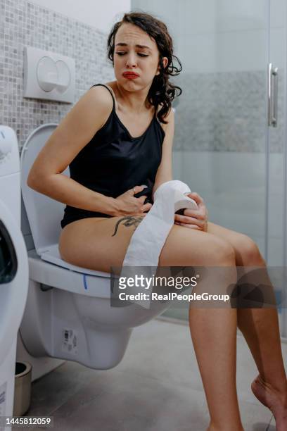 i don't know how to solve this problem - woman hemorrhoids stock pictures, royalty-free photos & images