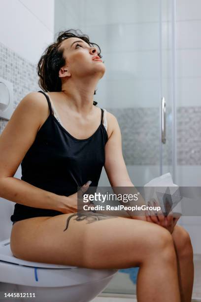 will this end? - woman hemorrhoids stock pictures, royalty-free photos & images
