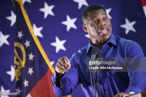 Georgia Republican senate candidate Herschel Walker speaks during a campaign rally on November 30, 2022 in Dalton, Georgia. With six days to go until...