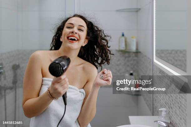 i immediately feel better after a bath - woman bath tub wet hair stock pictures, royalty-free photos & images