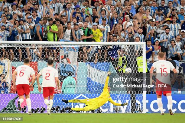 Lionel Messi of Argentina takes a penalty saved by Wojciech Szczesny of Poland during the FIFA World Cup Qatar 2022 Group C match between Poland and...