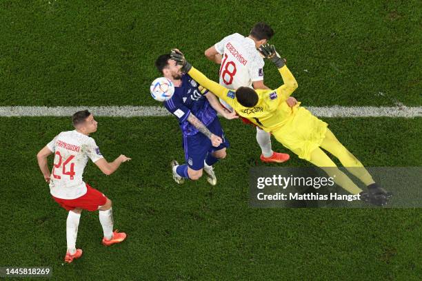 Lionel Messi of Argentina is fouled by Wojciech Szczesny of Poland which leads to a penalty during the FIFA World Cup Qatar 2022 Group C match...