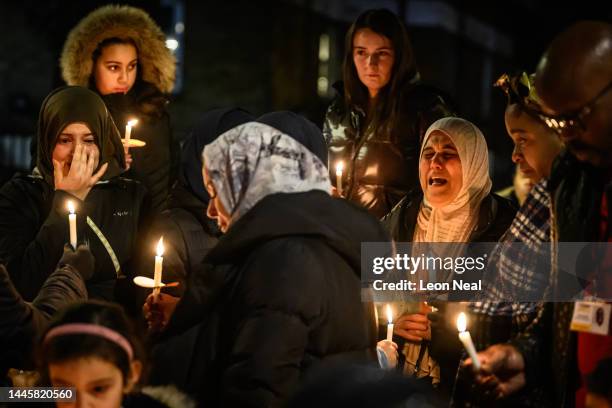 Woman cries out as members of the local community, politicians and faith leaders gather during a candle vigil to remember those killed through knife...