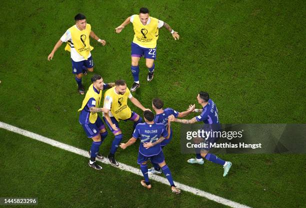 Alexis Mac Allister of Argentina celebrates with teammates after scoring their first goal during the FIFA World Cup Qatar 2022 Group C match between...