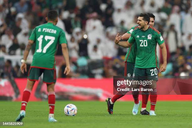 Henry Martin of Mexico celebrates scoring their team's first goal with their teammate Edson Alvarez during the FIFA World Cup Qatar 2022 Group C...