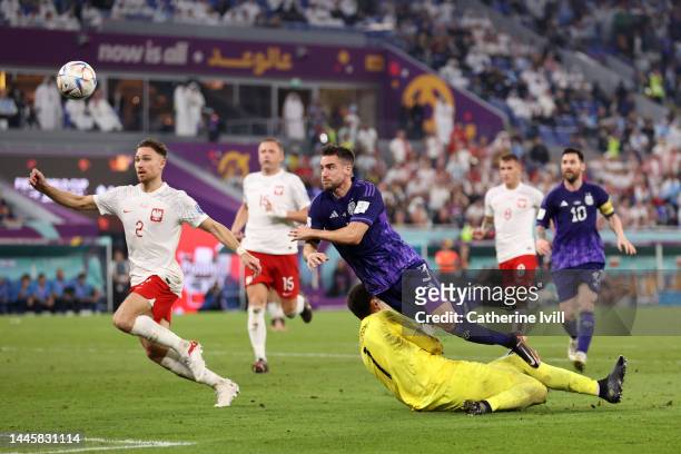 Nicolas Tagliafico of Argentina misses a chance against Wojciech Szczesny of Poland during the FIFA World Cup Qatar 2022 Group C match between Poland...