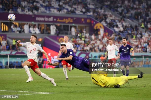 Nicolas Tagliafico of Argentina misses a chance against Wojciech Szczesny of Poland during the FIFA World Cup Qatar 2022 Group C match between Poland...