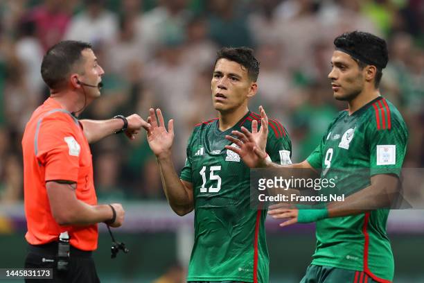 Raul Jimenez and Hector Moreno of Mexico protest to Referee Michael Oliver after their third goal is disallowed due to offside during the FIFA World...