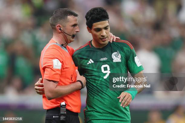 Raul Jimenez of Mexico talks to Referee Michael Oliver after his side's third goal is disallowed due to offside during the FIFA World Cup Qatar 2022...
