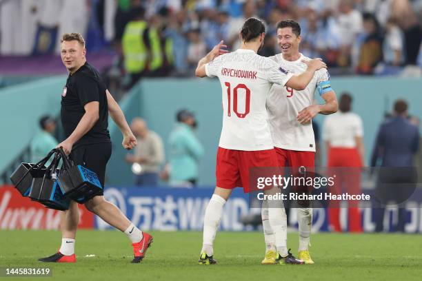 Robert Lewandowski and Grzegorz Krychowiak of Poland embrace after the FIFA World Cup Qatar 2022 Group C match between Poland and Argentina at...