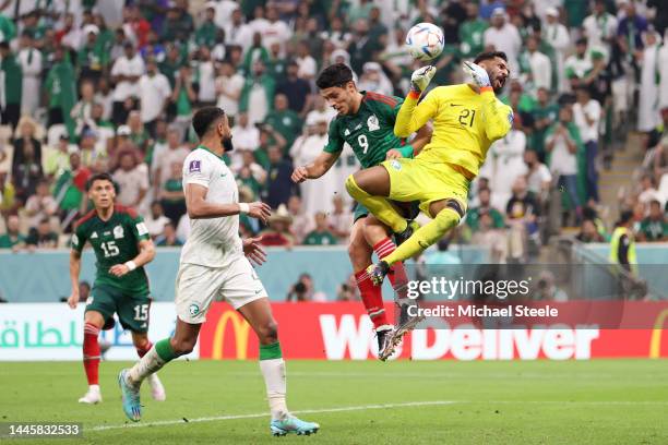 Mohammed Al-Owais of Saudi Arabia defends an attempt against Raul Jimenez of Mexico during the FIFA World Cup Qatar 2022 Group C match between Saudi...