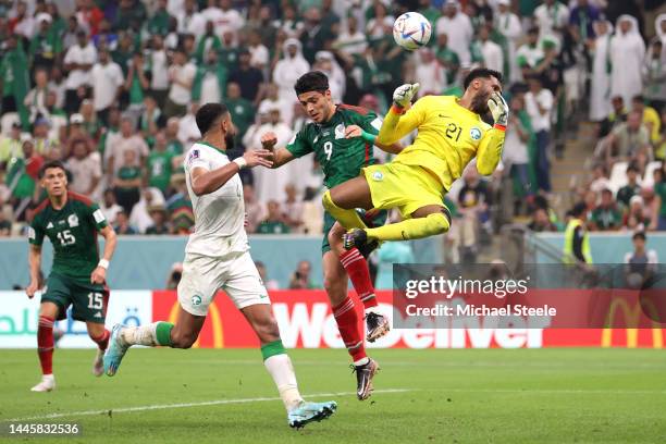 Mohammed Al-Owais of Saudi Arabia defends an attempt against Raul Jimenez of Mexico during the FIFA World Cup Qatar 2022 Group C match between Saudi...
