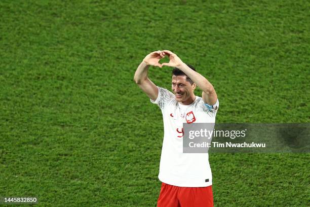 Robert Lewandowski of Poland celebrates after their sides qualification to the knockout stages after the FIFA World Cup Qatar 2022 Group C match...