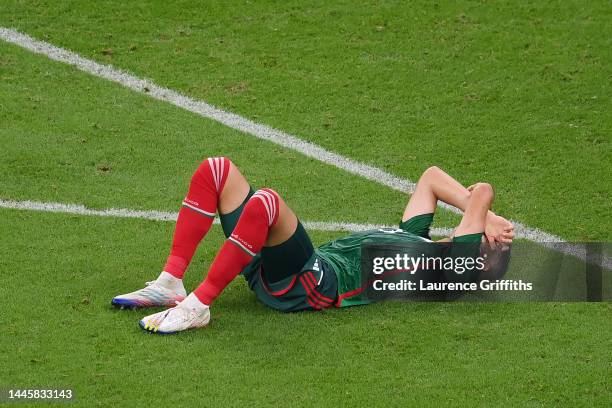 Cesar Montes of Mexico shows dejection as the team fails to go through to the knockout stage despite his side's 2-1 victory in the FIFA World Cup...