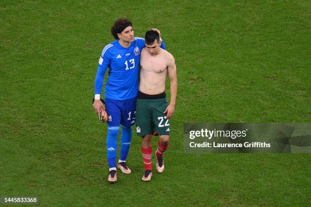 Hirving Lozano of Mexico is consoled by Guillermo Ochoa as the team fails to go through to the knockout stage despite the 2-1 victory in the FIFA...