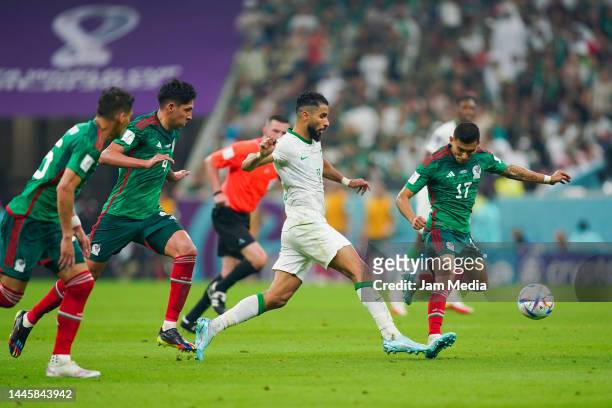 Edson Alvarez and Orbelin Pineda of Mexico fight for the ball with Saleh Al-Shehri of Saudi Arabia during the FIFA World Cup Qatar 2022 Group C match...