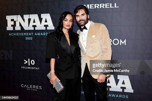 Amina Muaddi and Michael Atmore attend the 2022 Footwear News Achievement Awards at Cipriani South Street on November 30, 2022 in New York City.