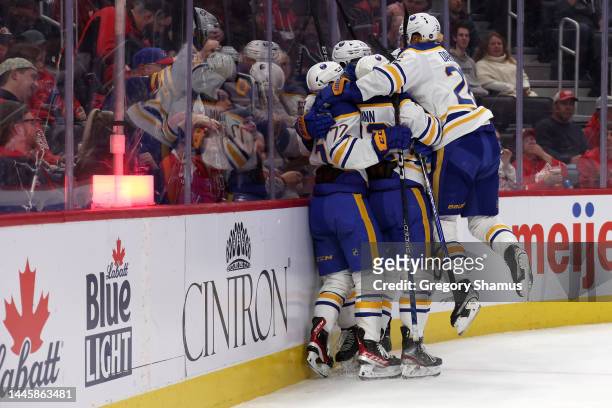 The Buffalo Sabres celebrate a first period goal by Mattias Samuelsson while playing the Detroit Red Wings at Little Caesars Arena on November 30,...