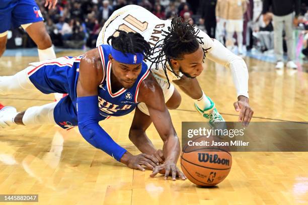 Danuel House Jr. #25 of the Philadelphia 76ers fights for a loose ball against Darius Garland of the Cleveland Cavaliers during the second half at...