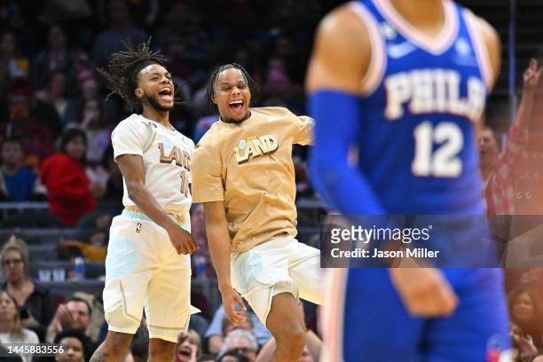 Darius Garland celebrates with Isaac Okoro of the Cleveland Cavaliers after the Cavaliers scored during the second half against the Philadelphia...