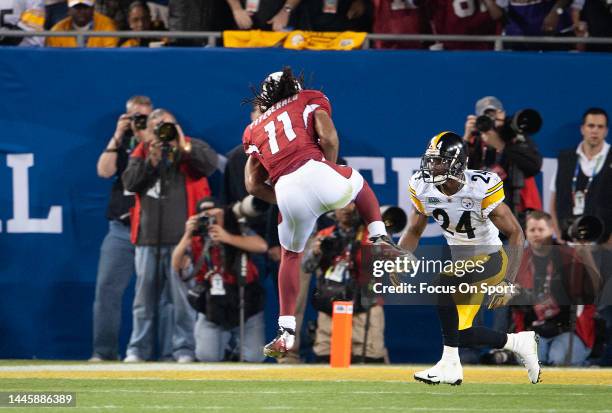 Larry Fitzgerald of the Arizona Cardinal catches a pass in front of Ike Taylor the Pittsburgh Steeler in Super Bowl XLIII on February 1, 2009 at...