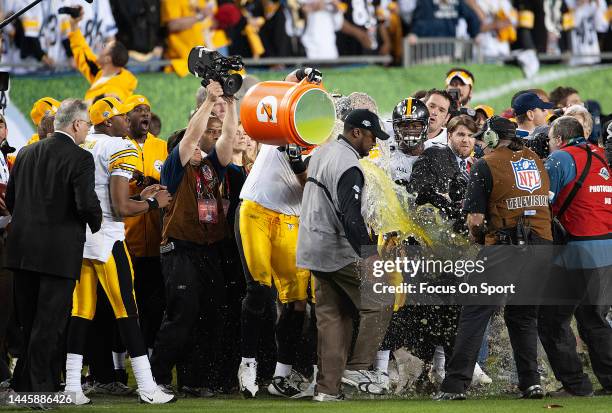 Head coach Mike Tomlin of the Pittsburgh Steelers is showered with gatorade by his players as they celebrate defeating the Arizona Cardinal in Super...