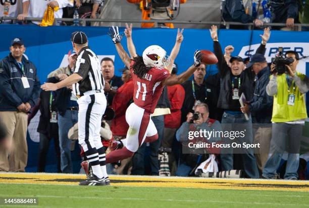 Larry Fitzgerald of the Arizona Cardinal celebrates after scoring a touchdown against the Pittsburgh Steeler in Super Bowl XLIII on February 1, 2009...