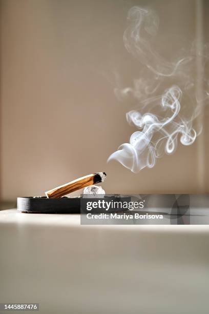 the palo santo wand in the home interior. - smudging ceremony stock pictures, royalty-free photos & images