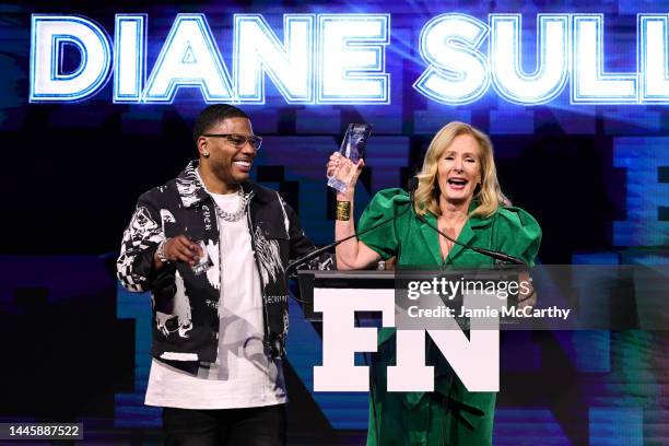 Diane Sullivan and Nelly speak onstage during the 2022 Footwear News Achievement Awards at Cipriani South Street on November 30, 2022 in New York...