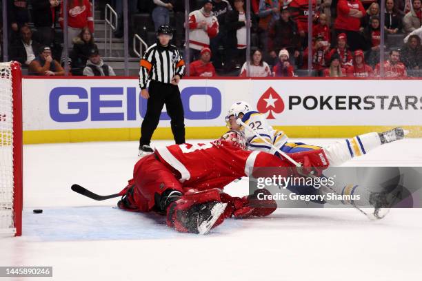 Jack Quinn of the Buffalo Sabres scores the game winning shootout goal around Alex Nedeljkovic of the Detroit Red Wings for a 5-4 win at Little...