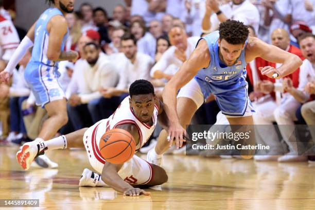 Jordan Geronimo of the Indiana Hoosiers and Pete Nance of the North Carolina Tar Heels dive for the ball during the first half at Simon Skjodt...