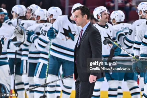 San Jose Sharks head coach David Quinn walks past his team as they celebrate a victory against the Montreal Canadiens at Centre Bell on November 29,...
