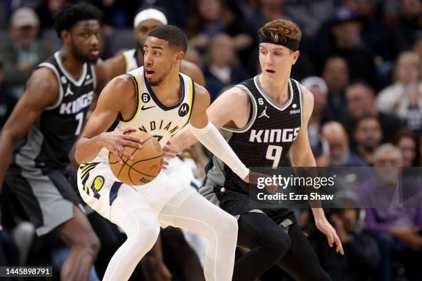 Tyrese Haliburton of the Indiana Pacers is guarded by Kevin Huerter of the Sacramento Kings at Golden 1 Center on November 30, 2022 in Sacramento,...