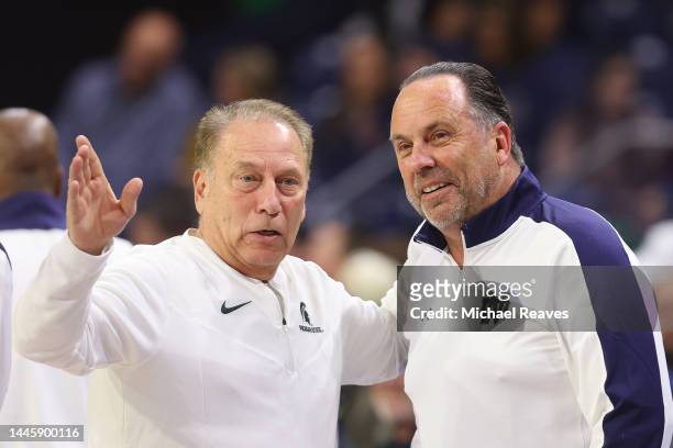 Head coach Tom Izzo of the Michigan State Spartans and head coach Mike Brey of the Notre Dame Fighting Irish talk prior to the game at the Purcell...