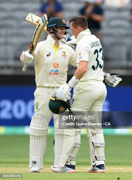 Marnus Labuschagne of Australia is congratulated by Steve Smith after bringing up his double century during day two of the First Test match between...