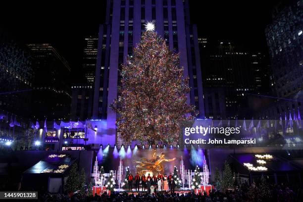 Craig Melvin, Hoda Kotb and Mario Lopez seen on stage during the 2022 Rockefeller Center Christmas Tree Lighting Ceremony at Rockefeller Center on...