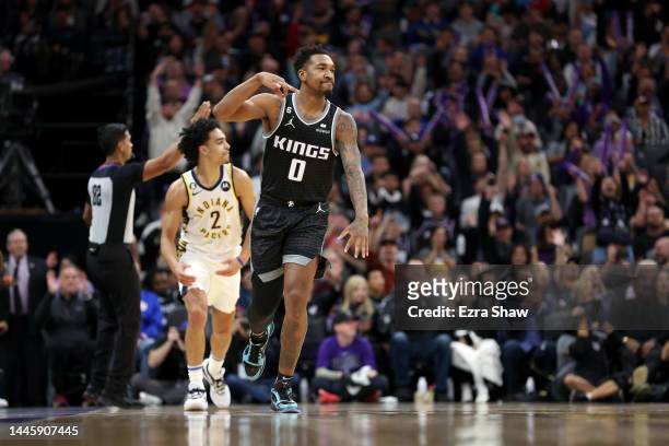 Malik Monk of the Sacramento Kings reacts after he made a basket against against the Indiana Pacers at Golden 1 Center on November 30, 2022 in...