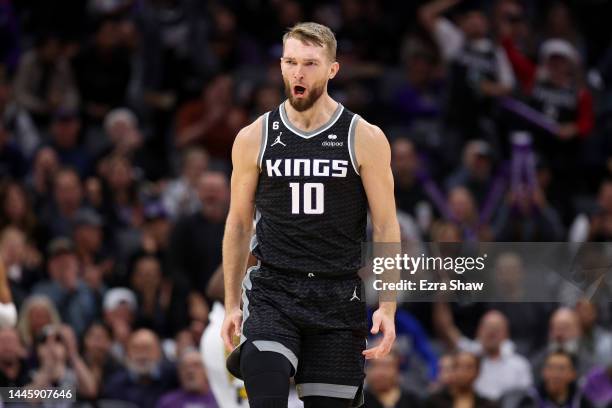 Domantas Sabonis of the Sacramento Kings reacts after the Kings made a basket against the Indiana Pacers at Golden 1 Center on November 30, 2022 in...