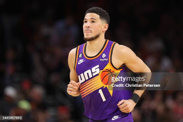 Devin Booker of the Phoenix Suns reacts during the second half of the NBA game against the Chicago Bulls at Footprint Center on November 30, 2022 in...