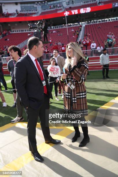 Jed York of the San Francisco 49ers with broadcaster Laura Okmin on the field before the game against the New Orleans Saints at Levi's Stadium on...