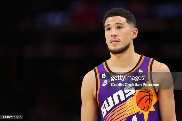 Devin Booker of the Phoenix Suns reacts during the second half of the NBA game against the Chicago Bulls at Footprint Center on November 30, 2022 in...