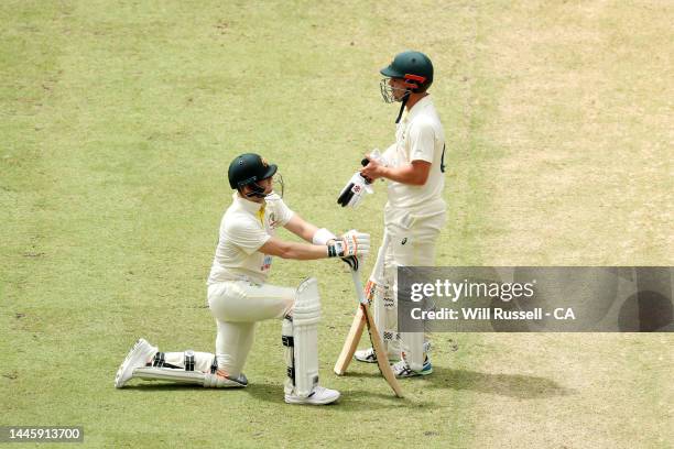 Steve Smith and Travis Head of Australia chat whilst waiting on a DRS decision during day two of the First Test match between Australia and the West...